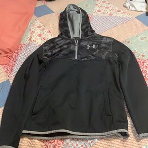 A black and grey under armor young boy sweater.